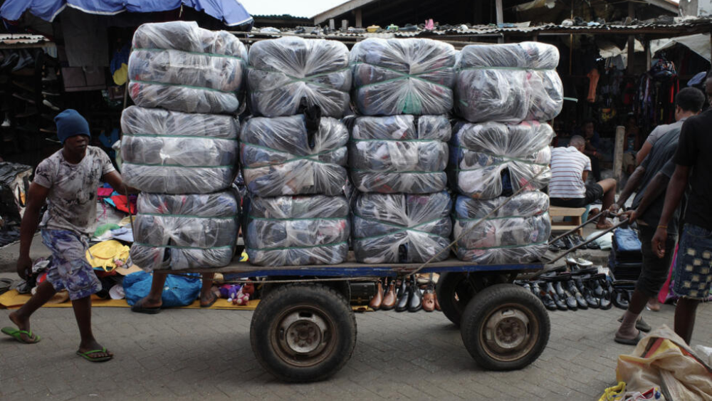 charity shops textiles clothing fast fashion environment sustainability climate vinted second hand africa